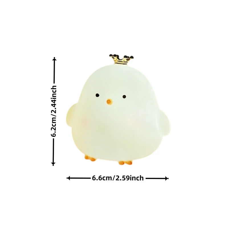 Small plush toy resembling a chick with measurements on a white background