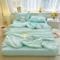 Blue  seersucker duvet set displayed on bed.