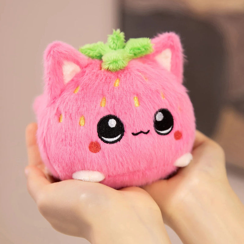 Front view of  Kawaii Strawberry Cat Plushie held by a woman