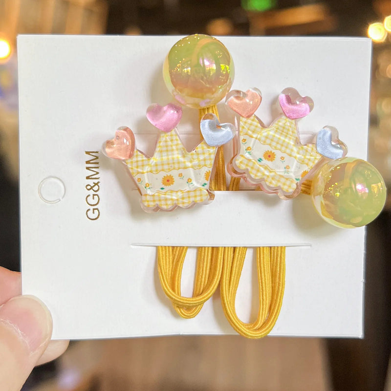 Pair of hair clips with checkered patterns and colorful accents on a white card.