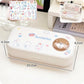 White rectangular container with cartoon designs and measurements on a white background