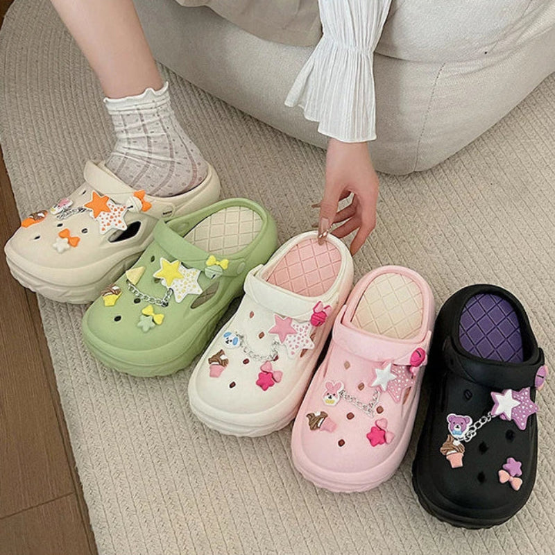 Colorful sandals with decorative stars and bows charms on a neutral background