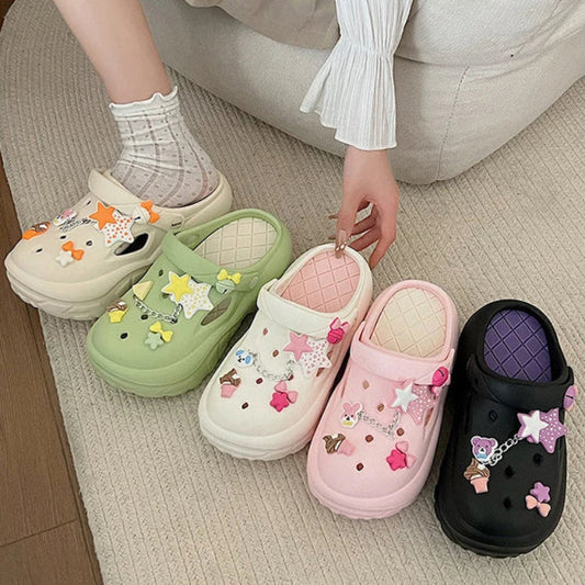 Colorful sandals with decorative stars and bows charms on a neutral background