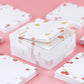 Stack of kawaii sticky notes with fruit patterns on a pink background