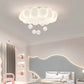 Modern bedroom with cloud-shaped ceiling light fixture
