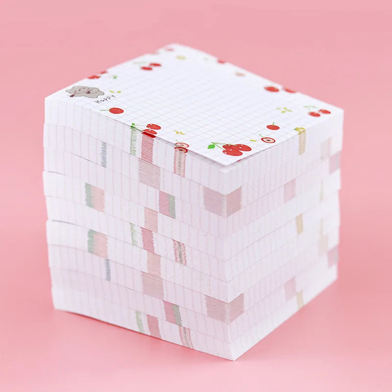 Stack of colorful kawaii sticky notes on a pink background