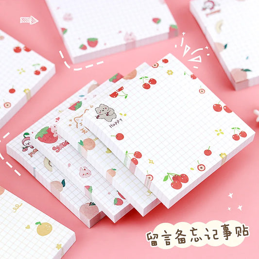 Set of small notebooks with kawaii  illustrations on a pink background