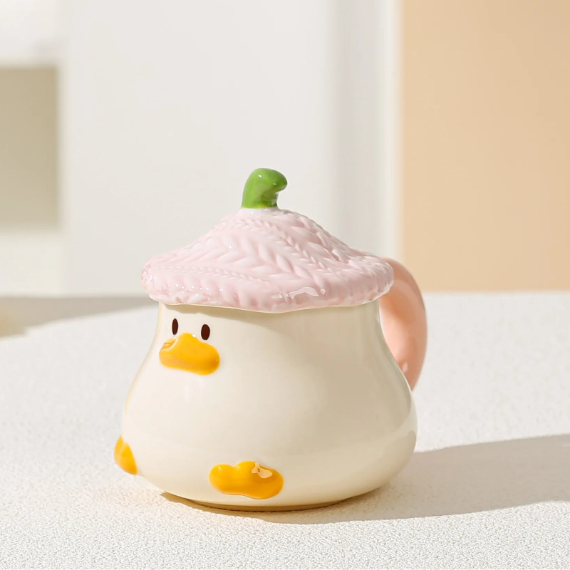 Kawaii Duck Mug with pink lid on countertop