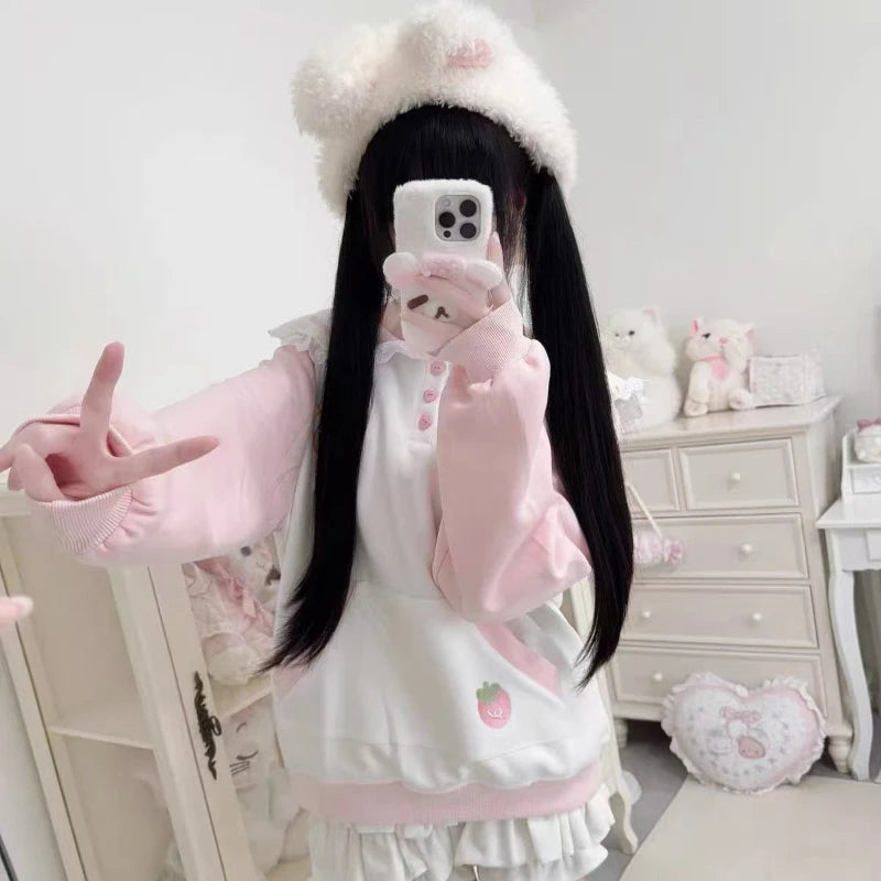 Person in a cute outfit with a white dresser and decorative items in the background