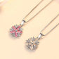 Sakura Cherry Blossom Necklace the hot pink version and the light pink version displayed together side by side on a pink background