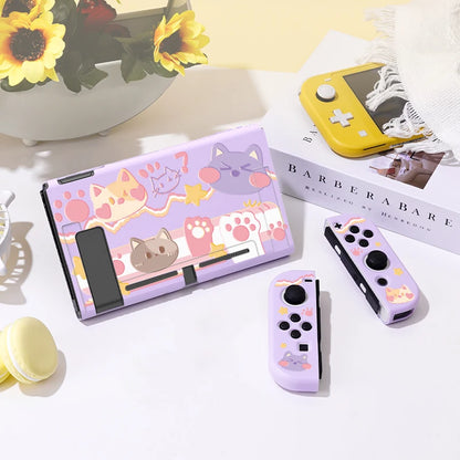 Gaming console set with cat-themed design on a light surface.