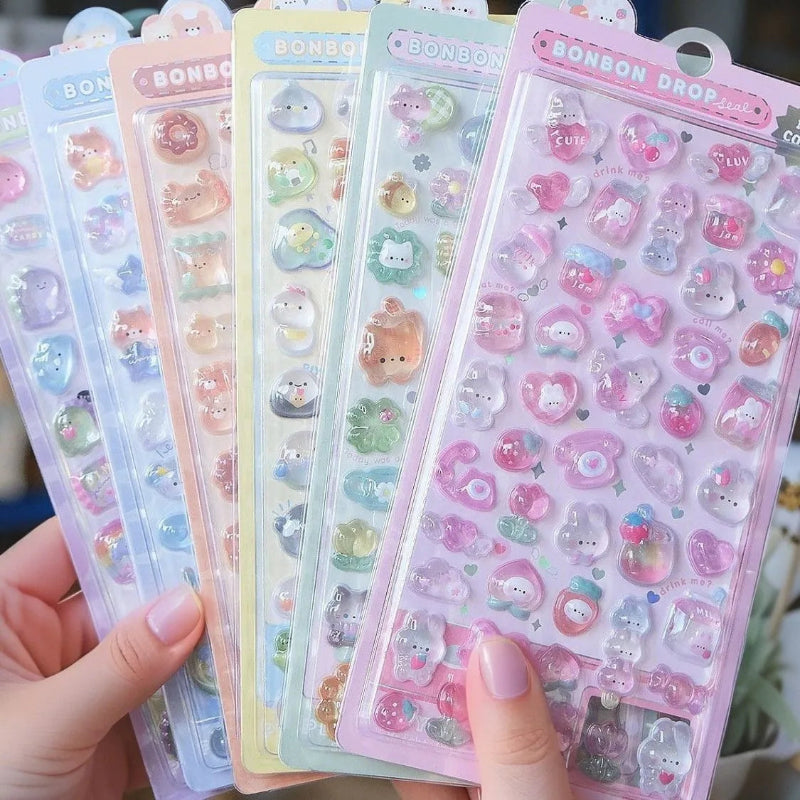 Colorful sticker sheets with cartoon characters held by a hand
