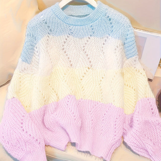 Color-blocked knitted sweater on a hanger with a neutral background