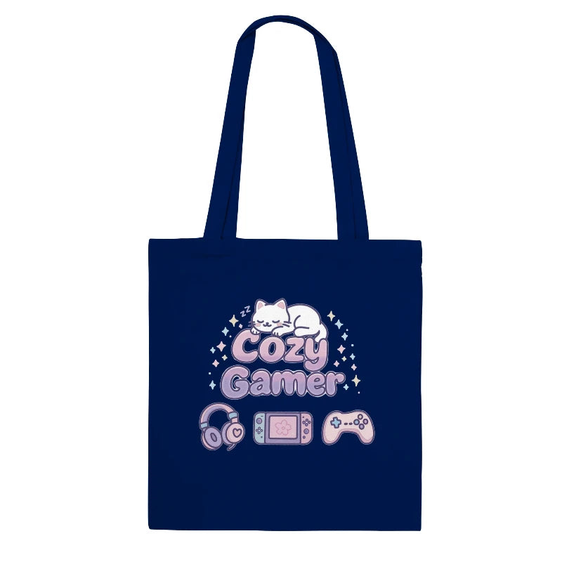 Navy blue tote bag with 'Cozy Gamer' design featuring a cat, gaming console, and controller on a white background.