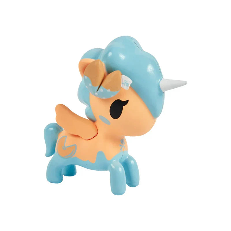 Toy unicorn with blue hair and orange body on a white background