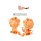 A small novelty toy set on a white background, featuring two peach-colored plastic unicorn-shaped halves with small white horns, a pink striped egg-shaped piece with a gold clasp, and a small paper tag with text.