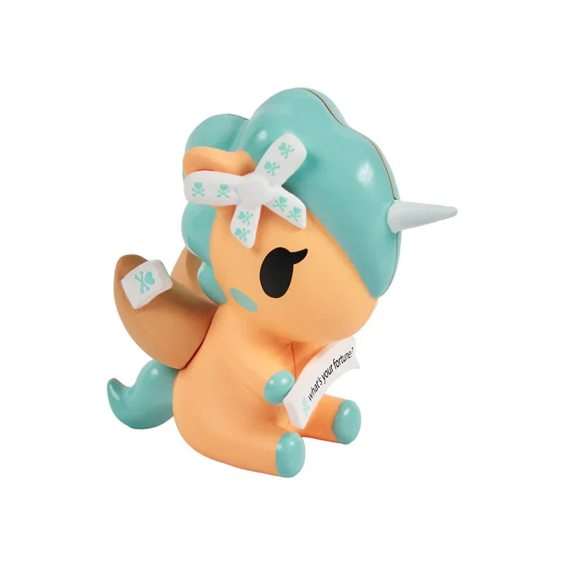 Plush toy with teal hair and orange body on a white background