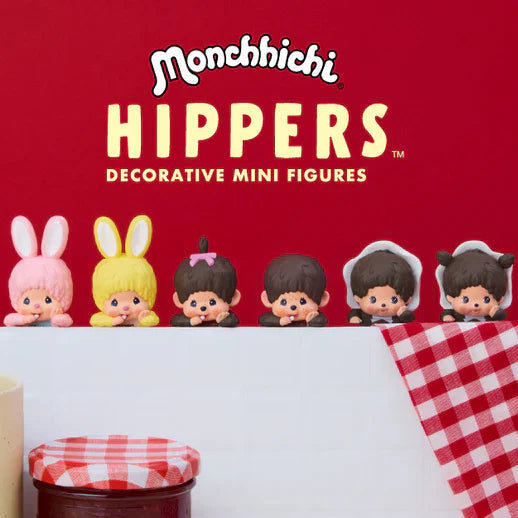 Monchhichi Hippers decorative mini figures on a red background with checkered tablecloth.