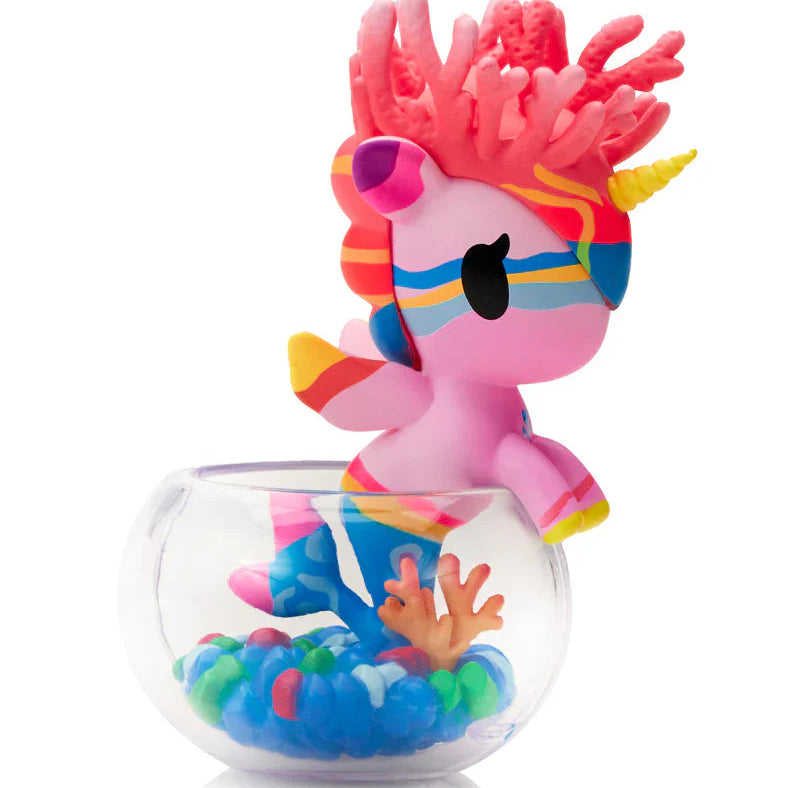 Kawaii unicorn blind box figurine with a glass base on a white background