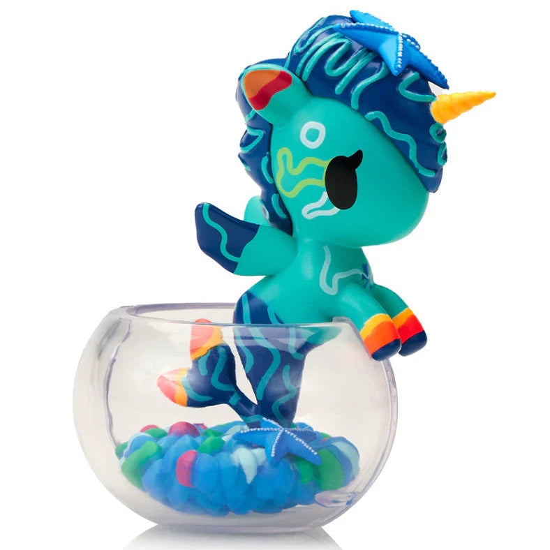 Kawaii blind box unicorn figure in a glass bowl on a white background