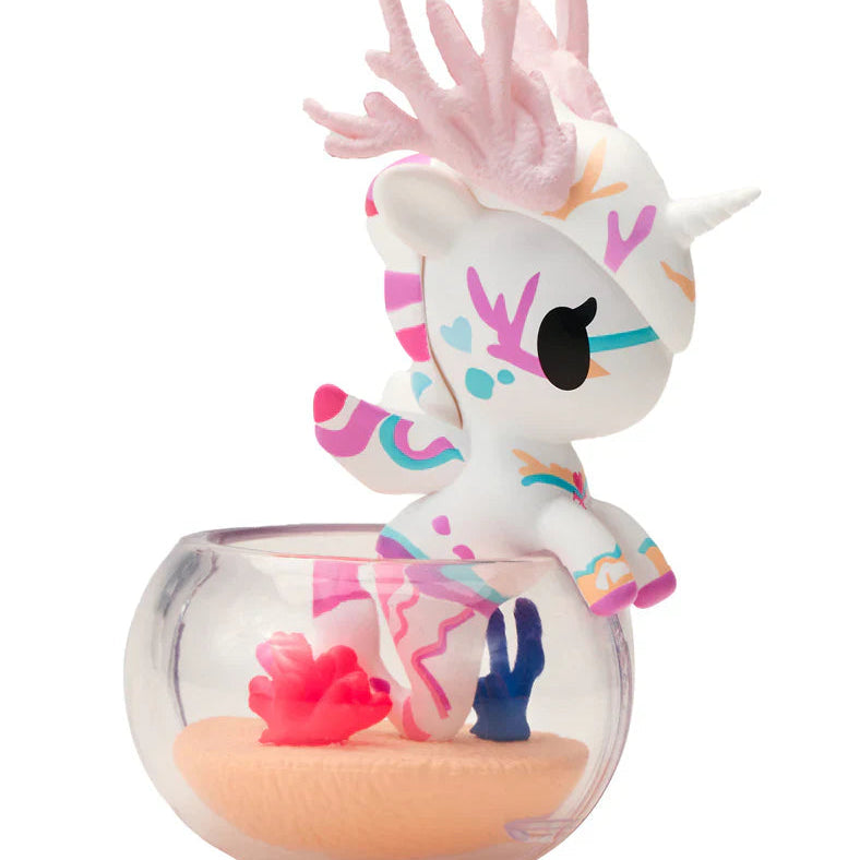 kawaii blindbox unicorn figuring with a glass base on a white background
