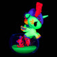 Colorful toy figure with glowing properties in a clear container on a black background