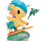 Colorful figurine of a character with blue hair and a dolphin on a white background