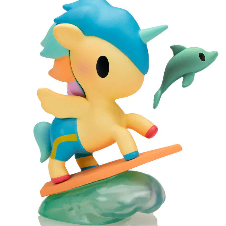 Colorful figurine of a character with blue hair and a dolphin on a white background