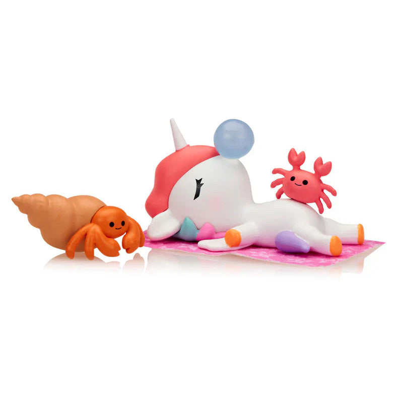 kawaii unicorn blind box figure passed out with two crabs