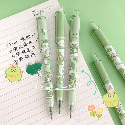 Kawaii Green Frog Gel Pens on a Notebook