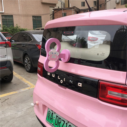 Kawaii Pink Wind Up Key on a Car