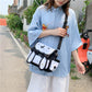 Model Holding Our Black Bunny Purse