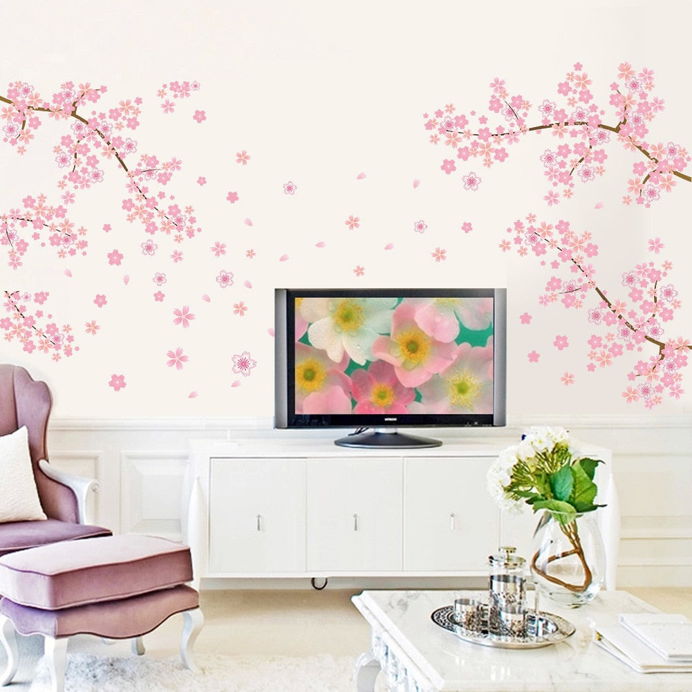 Kawaii Cherry Blossom Wall Decals in a Living Room Surrounding a TV in the Background