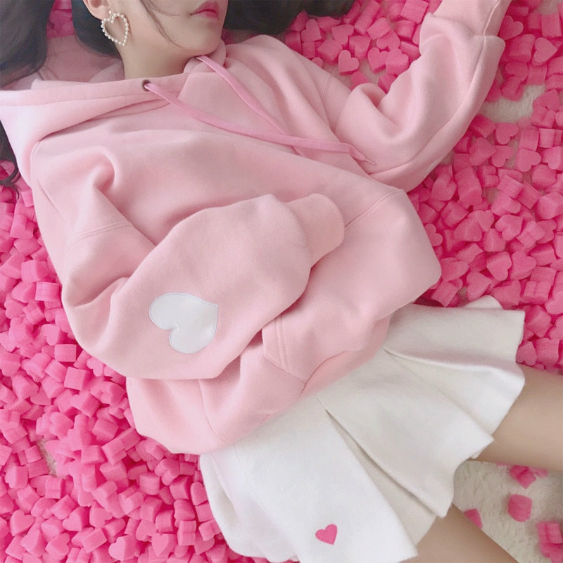 Model Wearing Kawaii Pink Heart Sleeve Hoodie Pullover