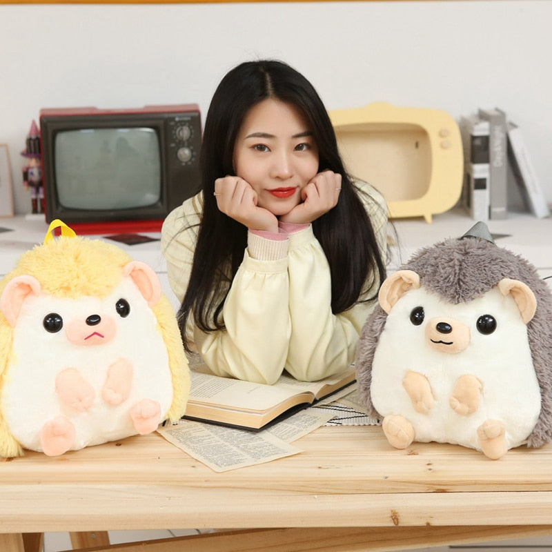 Model With Yellow and Grey Hedgehog Plushie Backpack