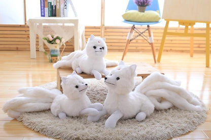 Three Kitsune Plushies on a Rug