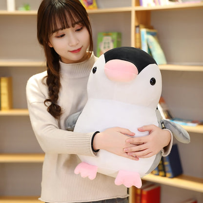 Model Holding Kawaii Penguin Plushie With Pink Beak
