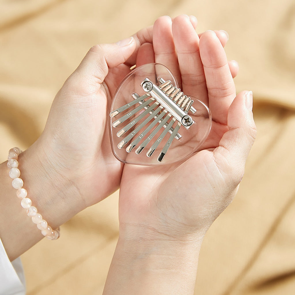 Hands Holding Kawaii Heart Shaped Kalimba