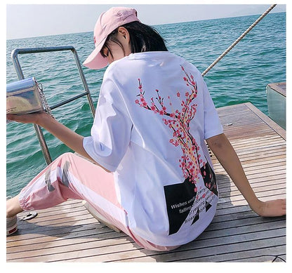 Girl Wearing Kawaii Peace Sakura Tracksuit