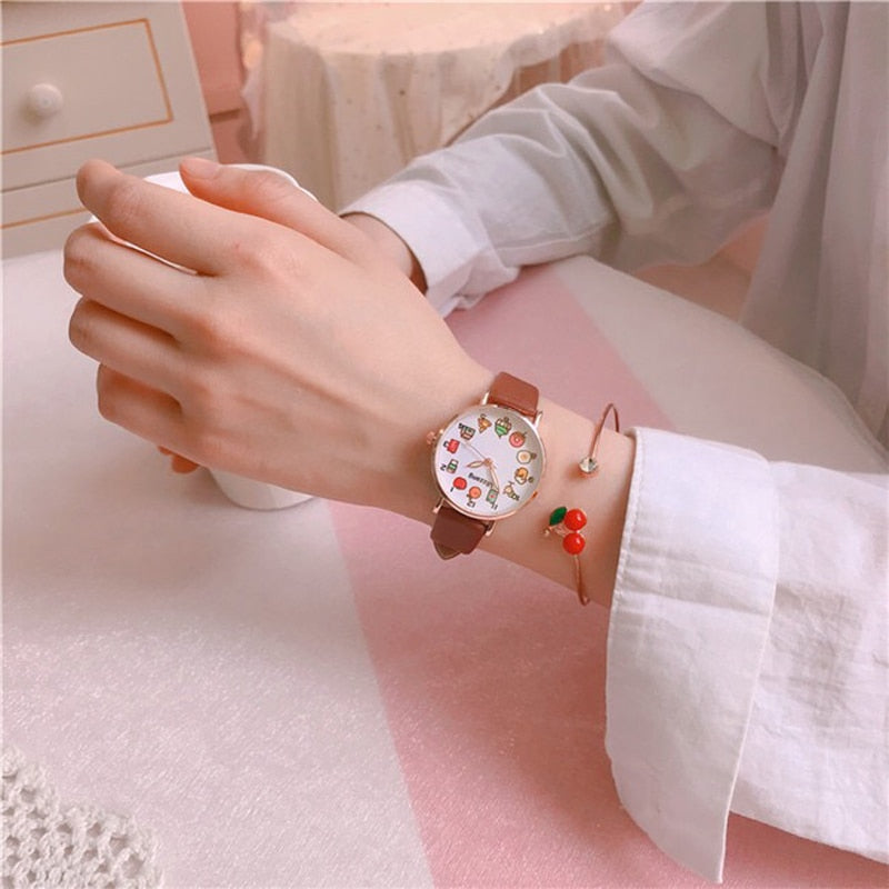 Kawaii Brown Watch and Cherry Braccelet on a Wrist