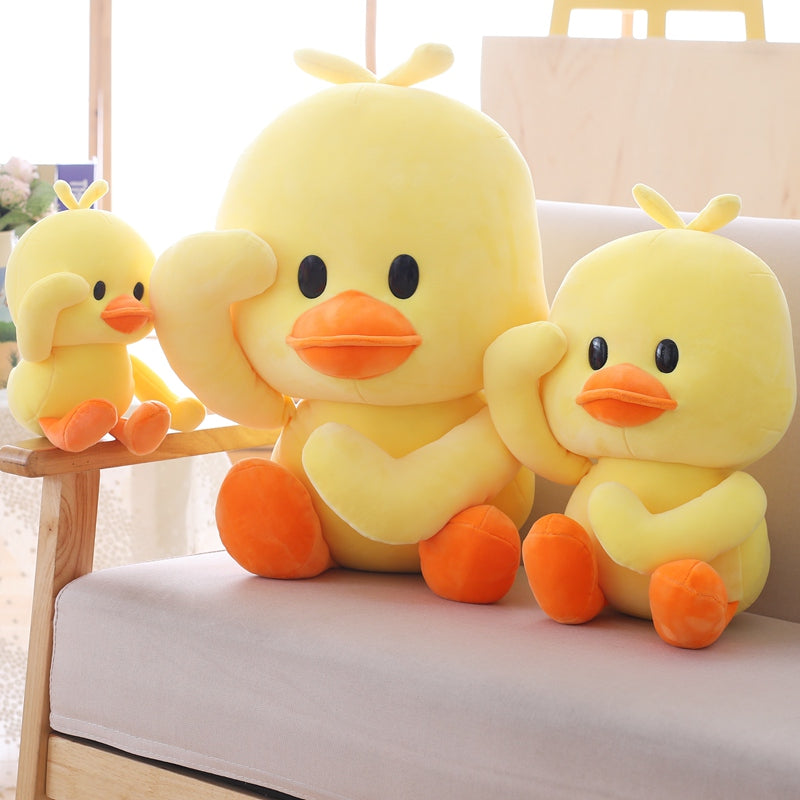 Three Kawaii Duck Plushies in Different Sizes