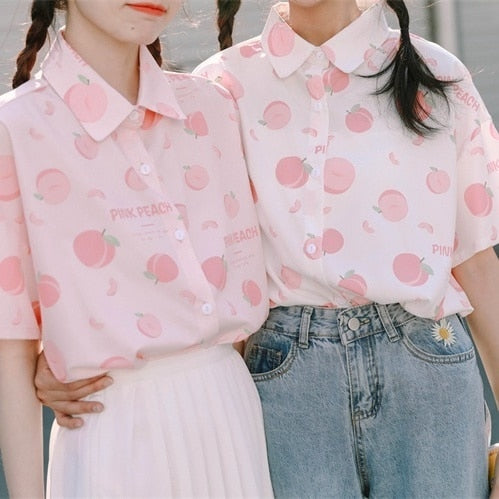 Two Models Wearing Pink and White Peach Print Blouses