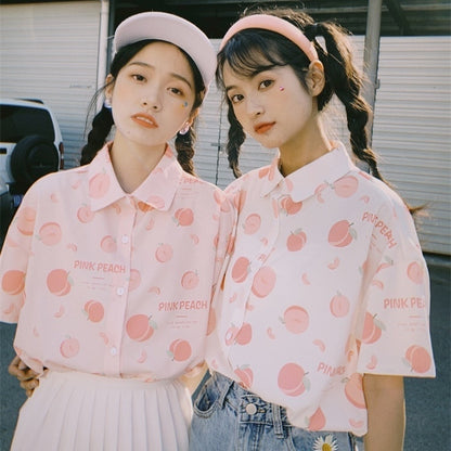 Models Wearing Pink and White Peach Print Blouses