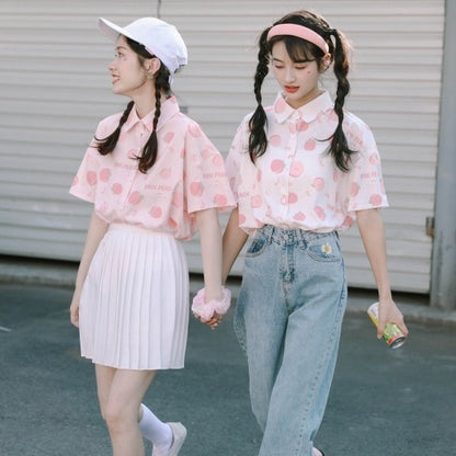 Models Wearing Pink and White Peach Print Blouses