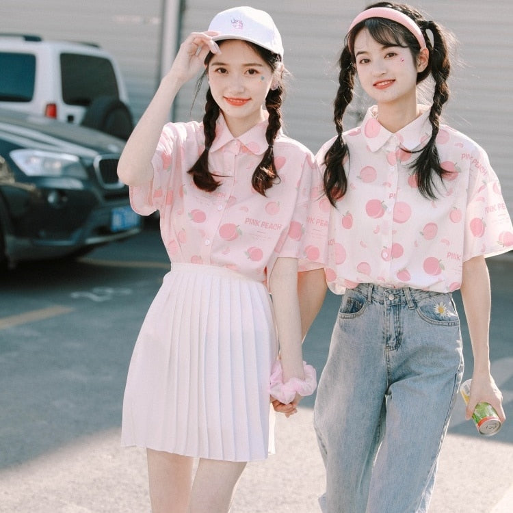 Models Wearing Peach Print Blouses