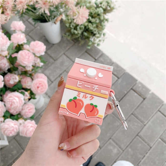 Hand Holding Peach Milk Carton Airpods Case